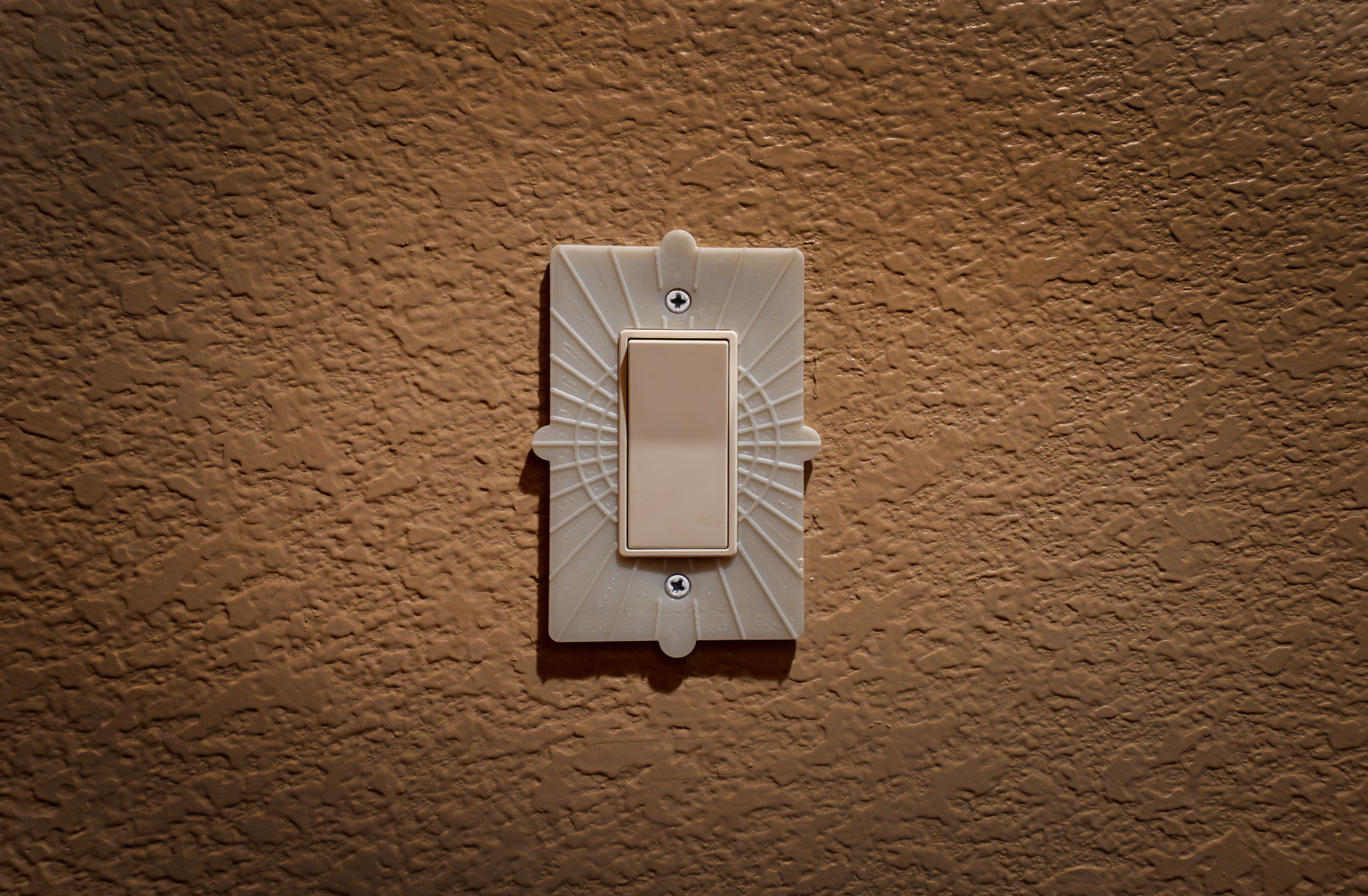 NightBloom Prime installed around a light switch with the room lights on